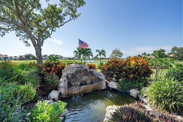 exterior space with a small pond