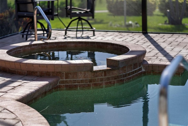 view of community with a jacuzzi