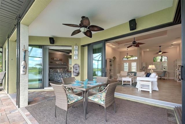 exterior space featuring arched walkways and stone tile floors