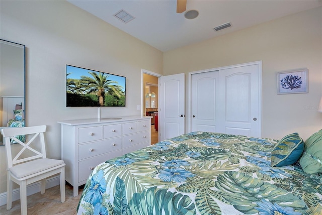 bedroom with a ceiling fan, a closet, visible vents, and light tile patterned floors