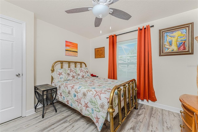 bedroom featuring ceiling fan and light hardwood / wood-style floors