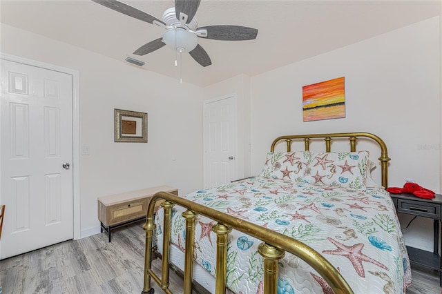 bedroom featuring hardwood / wood-style floors and ceiling fan