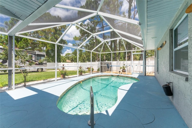 view of pool featuring a patio and a lanai