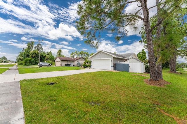 ranch-style house with a garage and a front lawn