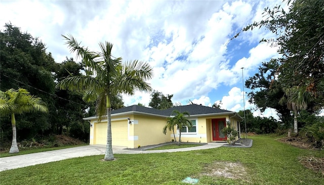 ranch-style home featuring a garage, stucco siding, concrete driveway, and a front yard