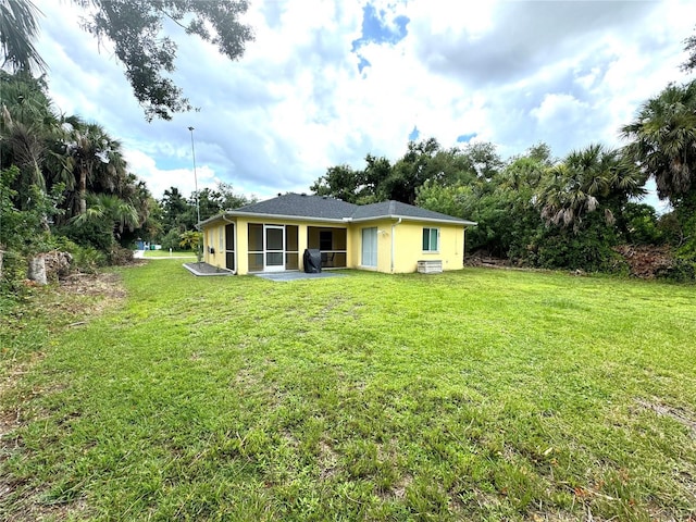 view of yard featuring a sunroom