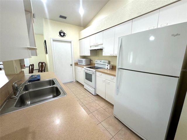 kitchen featuring visible vents, a sink, under cabinet range hood, white appliances, and white cabinets