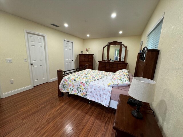 bedroom with hardwood / wood-style flooring