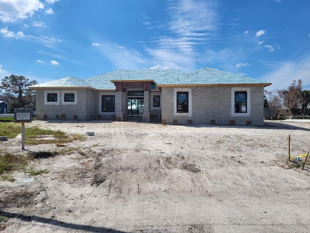 view of front facade featuring concrete block siding