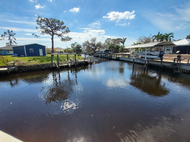 water view featuring boat lift and a dock