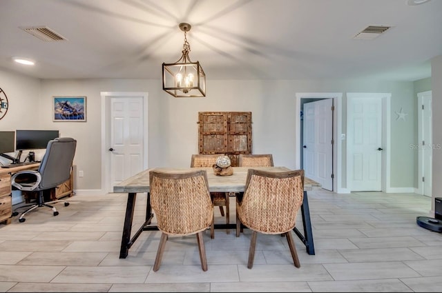 dining space featuring baseboards and visible vents