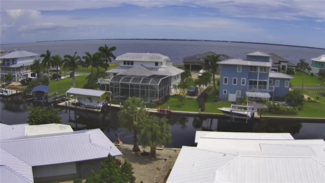 aerial view featuring a water view and a residential view