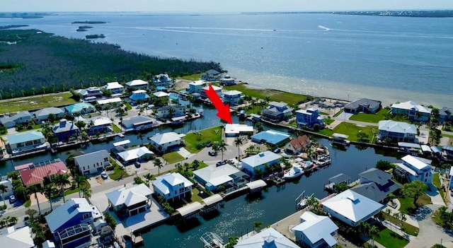 bird's eye view featuring a residential view and a water view