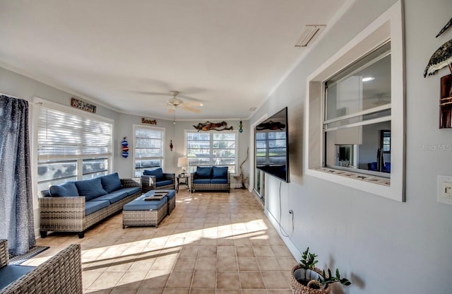 sunroom / solarium with ceiling fan