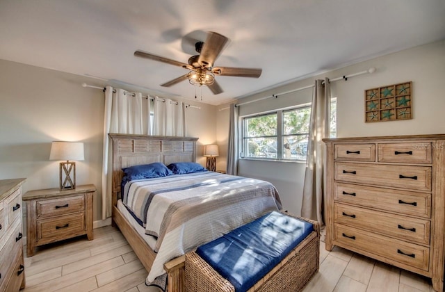 bedroom featuring ceiling fan and light hardwood / wood-style flooring