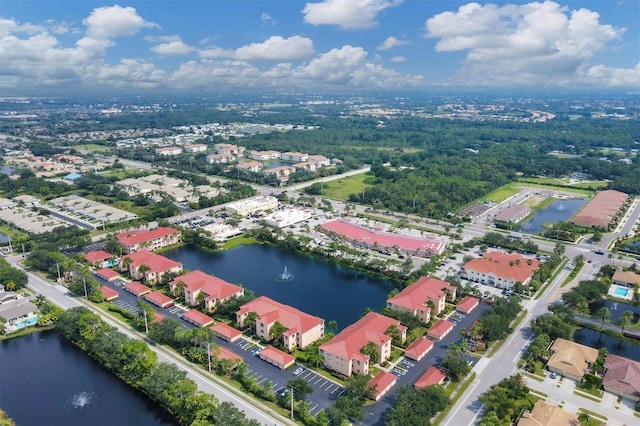 birds eye view of property with a water view and a residential view