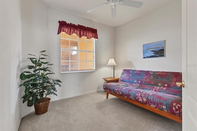 interior space with carpet flooring, ceiling fan, and baseboards