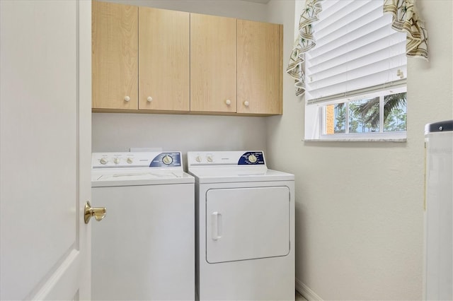 laundry room with cabinet space and washer and dryer