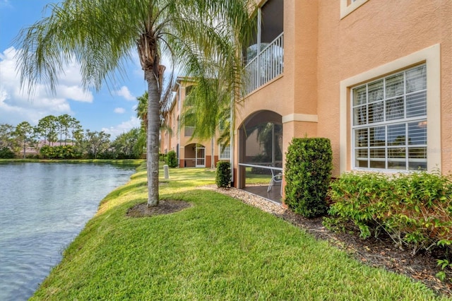 exterior space featuring a water view and a balcony