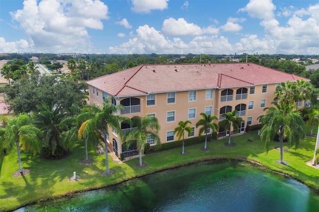 birds eye view of property with a water view