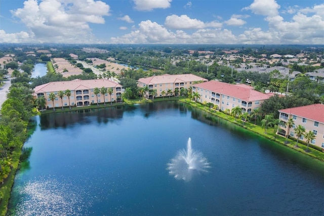 birds eye view of property featuring a water view and a residential view