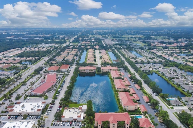 birds eye view of property featuring a water view and a residential view