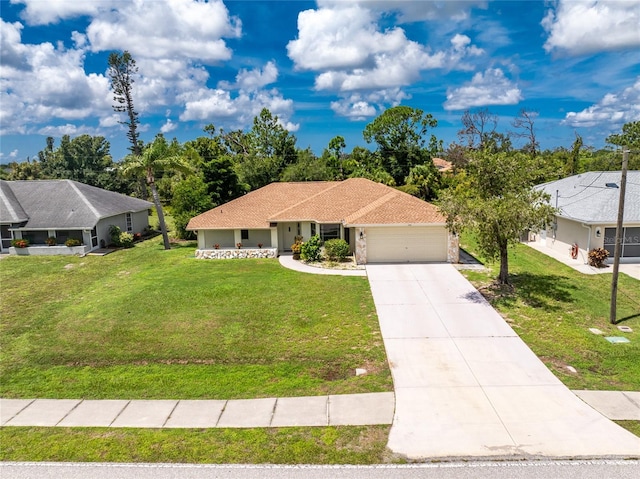 view of front of house with concrete driveway, a front lawn, roof with shingles, and an attached garage