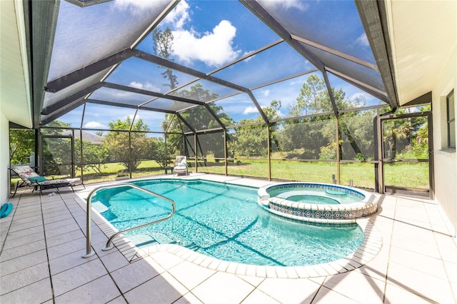 view of swimming pool with a yard, a pool with connected hot tub, a patio, and a lanai