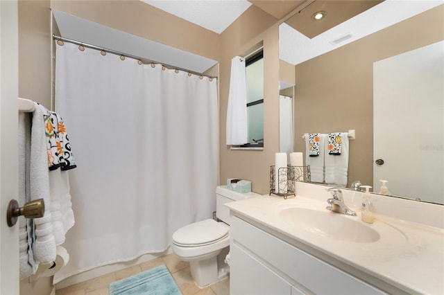 bathroom featuring tile patterned flooring, toilet, a shower with shower curtain, vanity, and visible vents