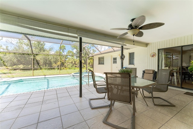 sunroom with a ceiling fan and a swimming pool