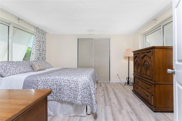 bedroom featuring a closet and light hardwood / wood-style floors