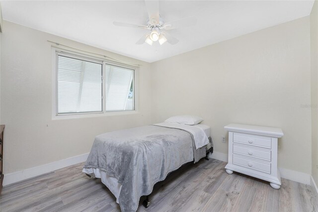 bedroom featuring light wood-type flooring and ceiling fan