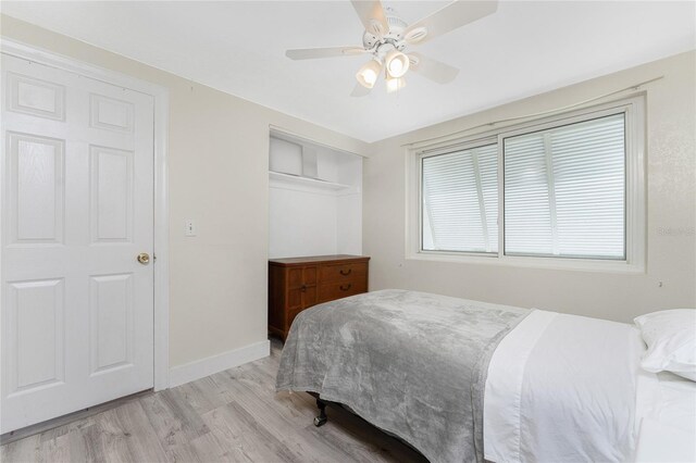 bedroom with ceiling fan and light hardwood / wood-style flooring