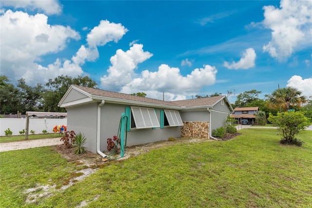 view of property exterior featuring a yard