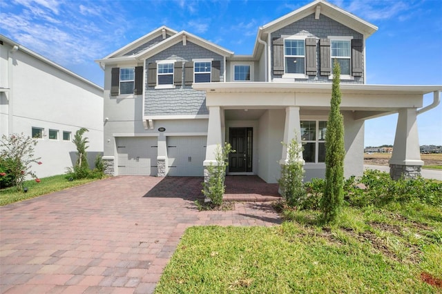 view of front of home featuring a garage and covered porch