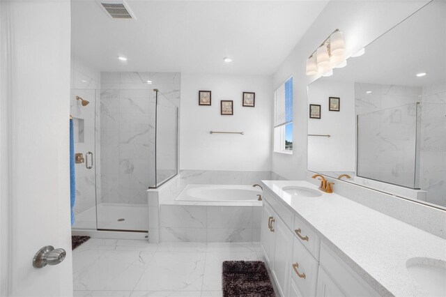 bathroom with separate shower and tub and vanity