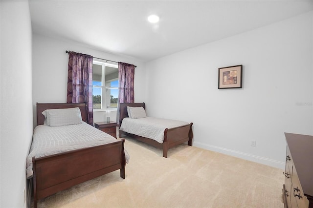 bedroom with light carpet