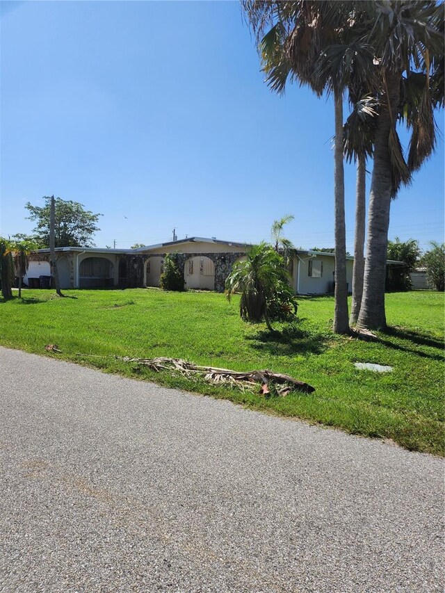 exterior space featuring a front lawn