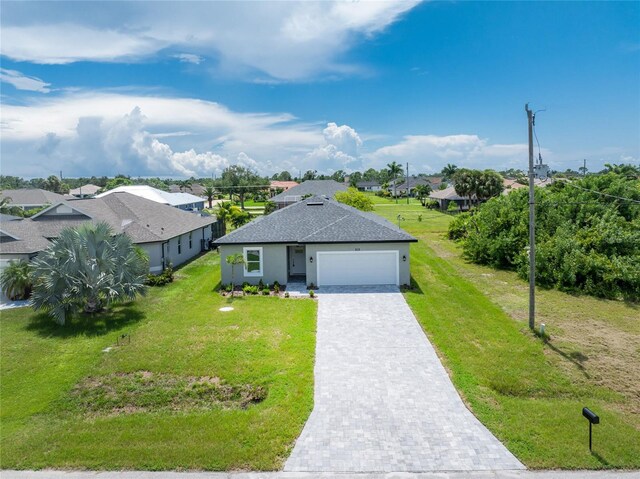 ranch-style home featuring a garage and a front lawn