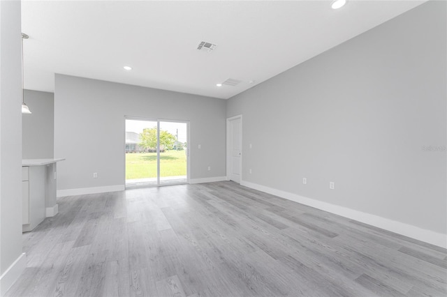 unfurnished living room featuring light wood-type flooring