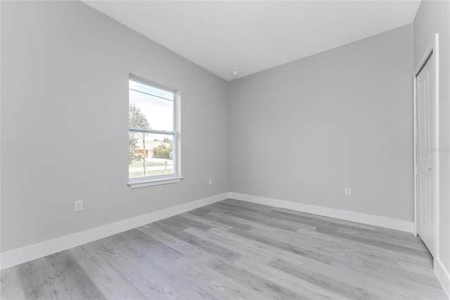 unfurnished room with light hardwood / wood-style flooring