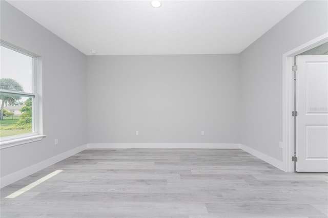 unfurnished room with light hardwood / wood-style floors