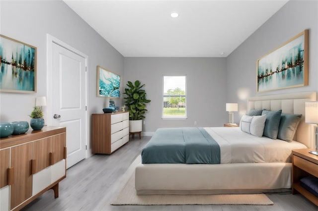 bedroom with light hardwood / wood-style floors