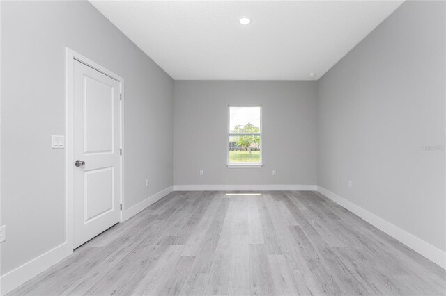 spare room featuring light hardwood / wood-style floors