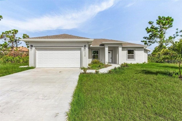 view of front of property featuring a garage and a front lawn