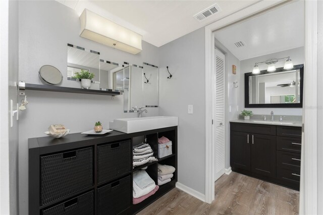 full bath featuring wood finished floors, visible vents, a closet, and a sink