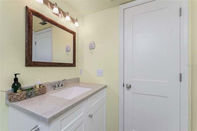 bathroom featuring visible vents and vanity