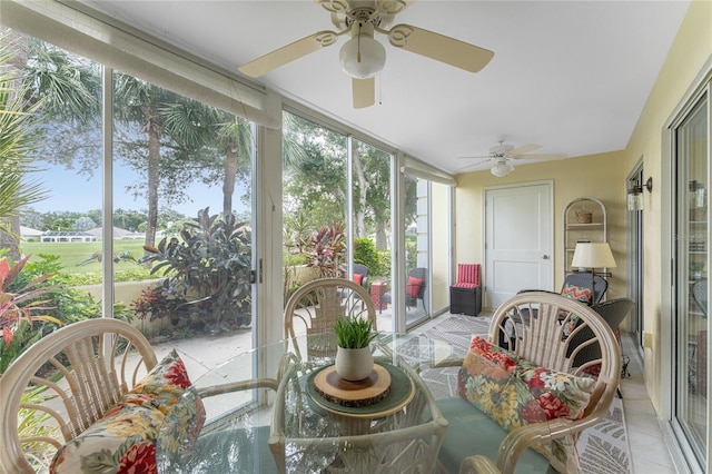 sunroom / solarium with a ceiling fan