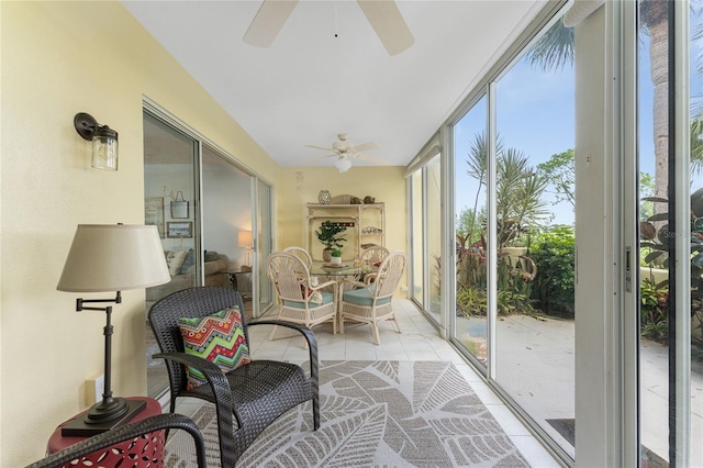 sunroom featuring ceiling fan