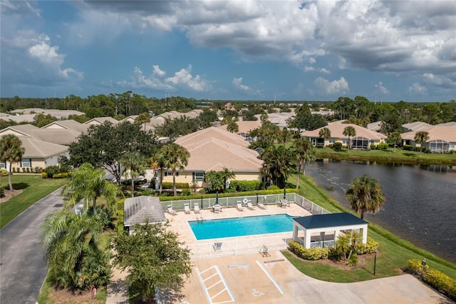 aerial view with a residential view and a water view